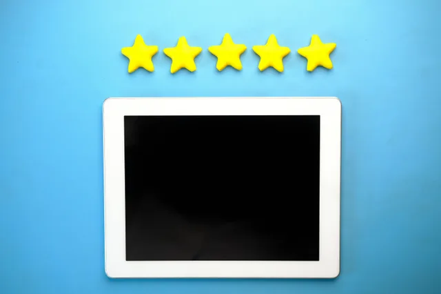 Tablet with five yellow stars on a blue background, ideal for rating concepts. Spotting Healthcare Reputation Management Mistakes Before They Cost Money