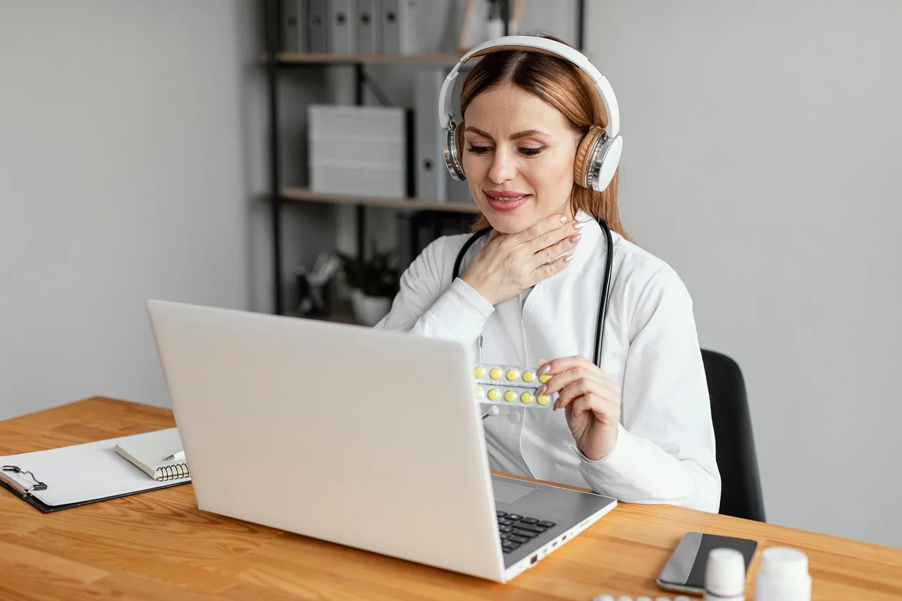 doctor, headphones, capsules, video call, computer, desk, workspace, healthcare, telemedicine, medication, sore throat, home office, video conferencing, communication, general practitioner, medical care, diagnosis, medical consultation, woman, online services. Is Healthcare Social Media Held to a Different Standard?